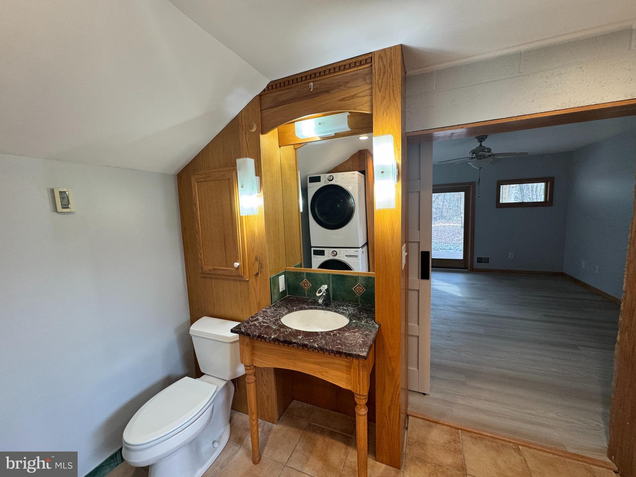2427 Grubb Road Wilmington, DE 19810 - Photo 9 of 32 a bathroom with a toilet a sink and mirror