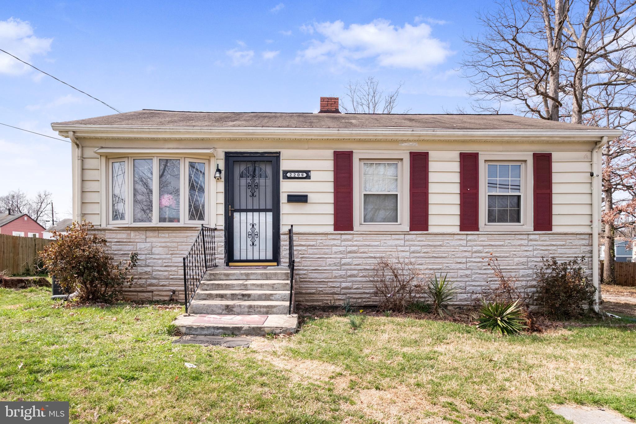 2208 Virginia Avenue Landover, MD 20785 - Photo 1 of 17 a front view of a house with a yard