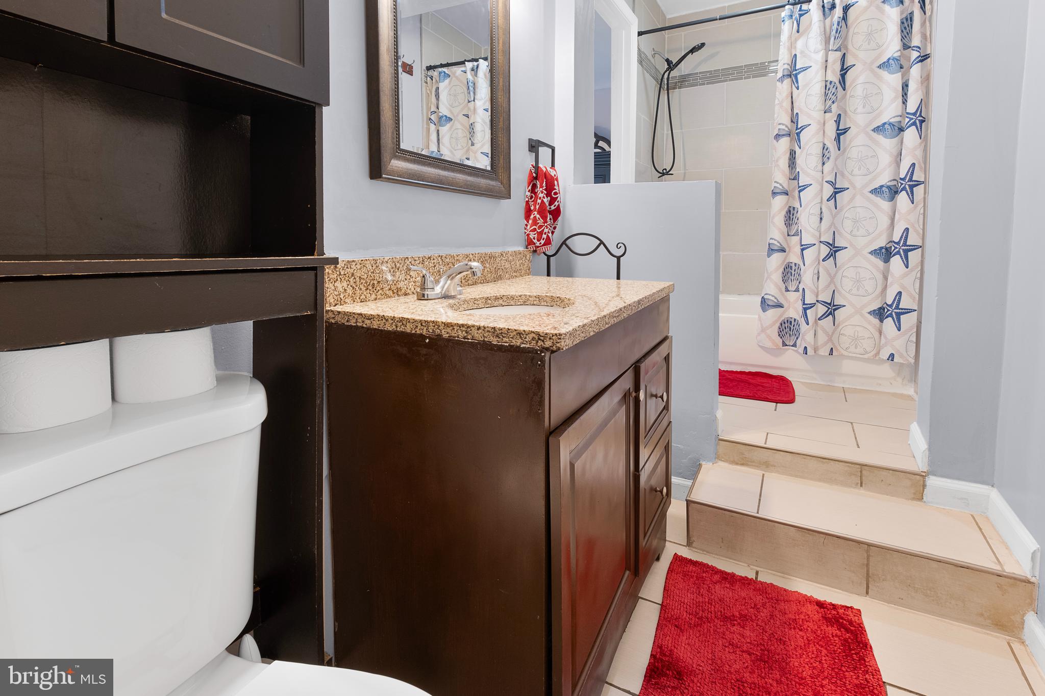 2208 Virginia Avenue Landover, MD 20785 - Photo 12 of 17 a bathroom with a sink and a mirror