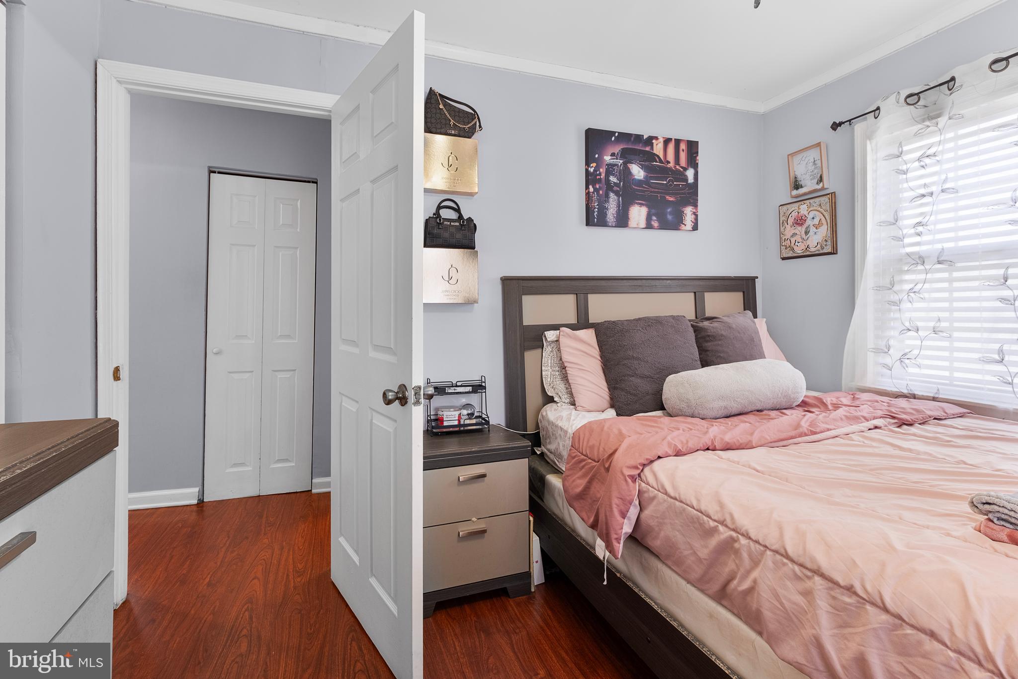 2208 Virginia Avenue Landover, MD 20785 - Photo 13 of 17 a bedroom with a bed and a painting on the wall