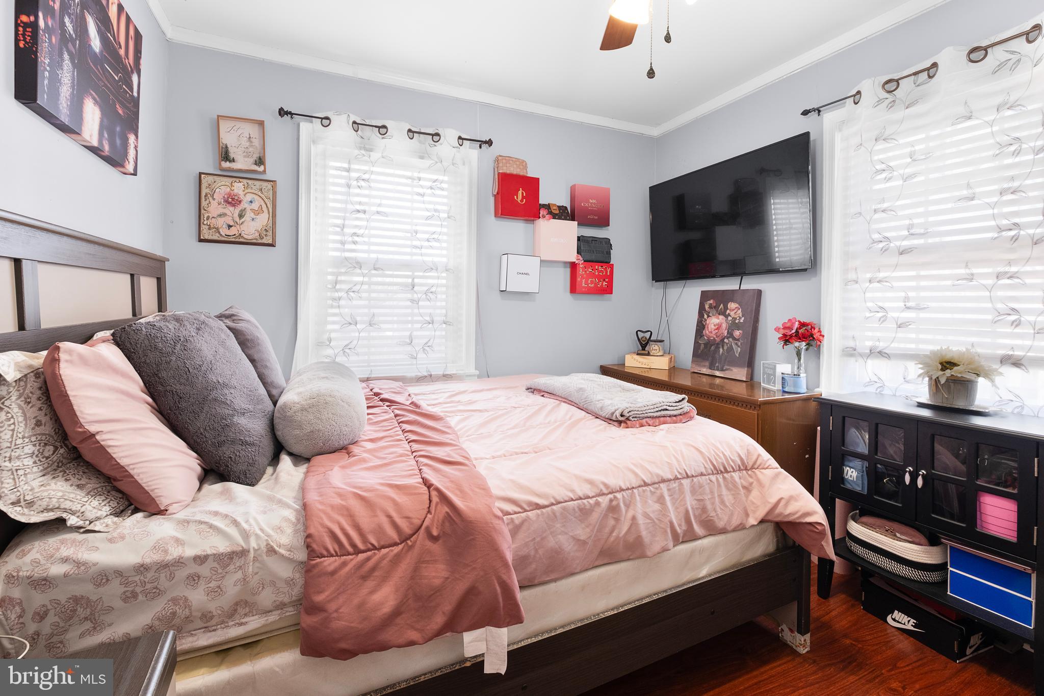 2208 Virginia Avenue Landover, MD 20785 - Photo 14 of 17 a bedroom with a bed and a flat screen tv