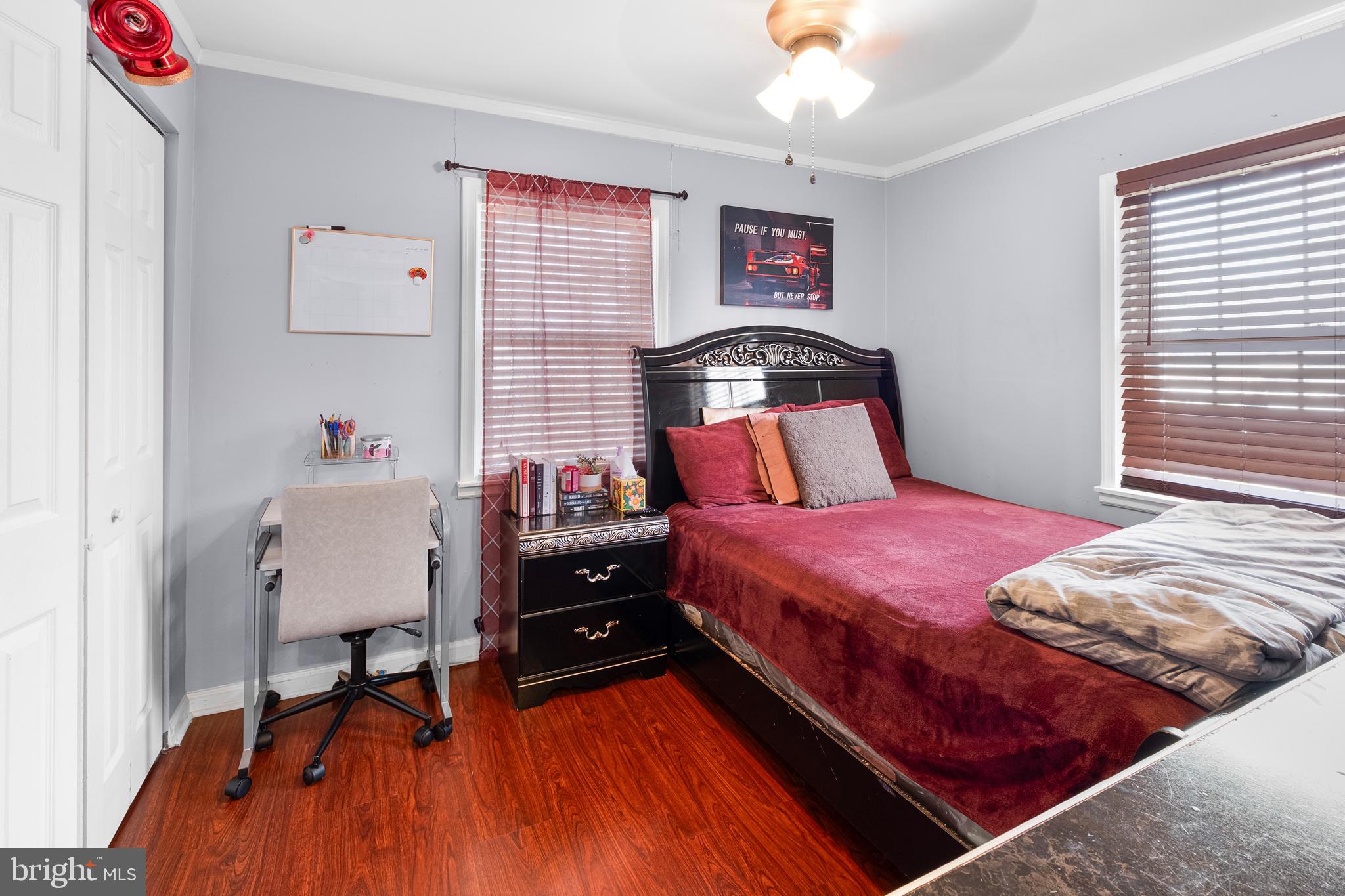 2208 Virginia Avenue Landover, MD 20785 - Photo 15 of 17 a bedroom with a bed and a dresser in it