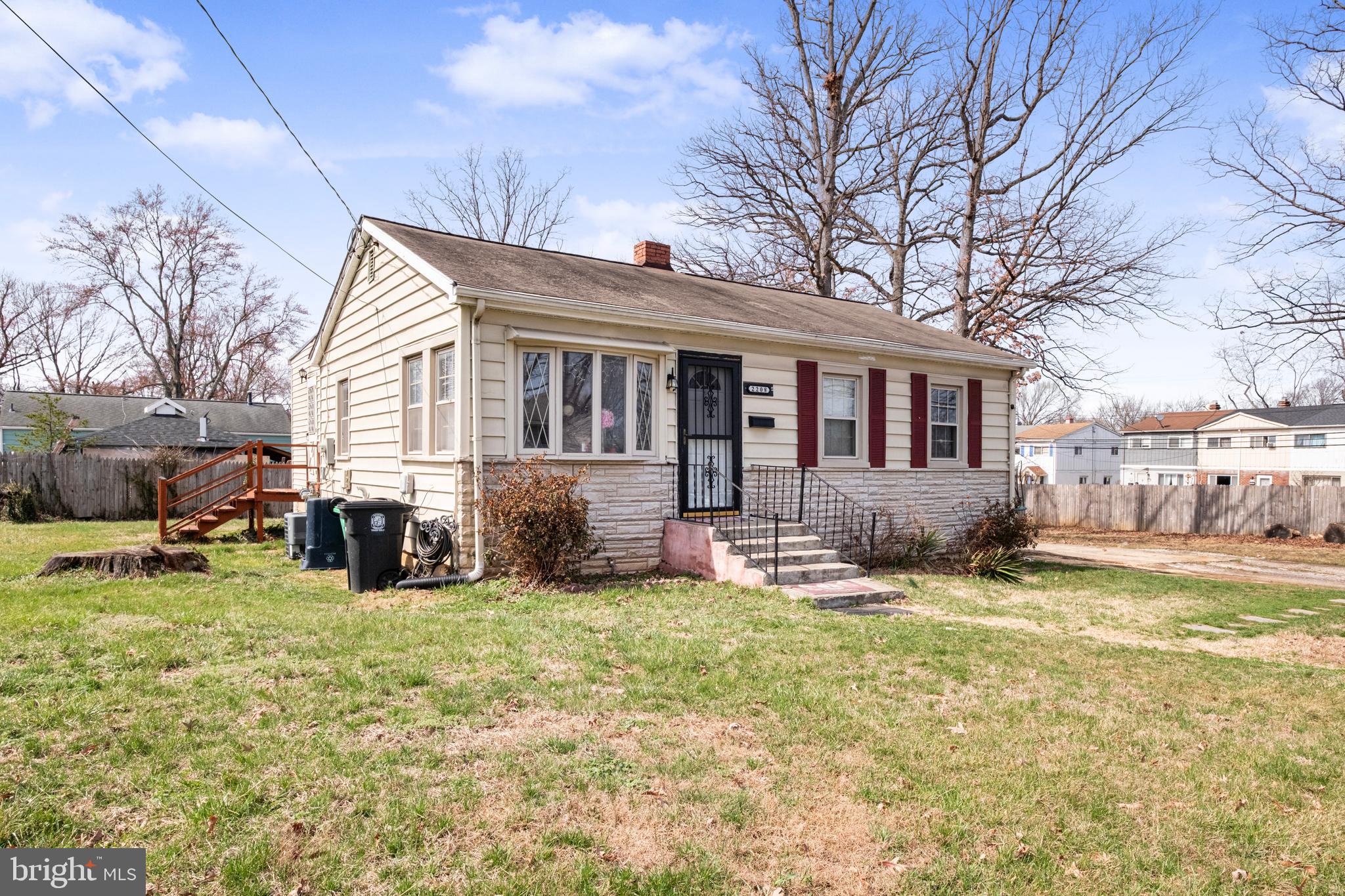 2208 Virginia Avenue Landover, MD 20785 - Photo 2 of 17 a view of a house with a yard patio and fire pit