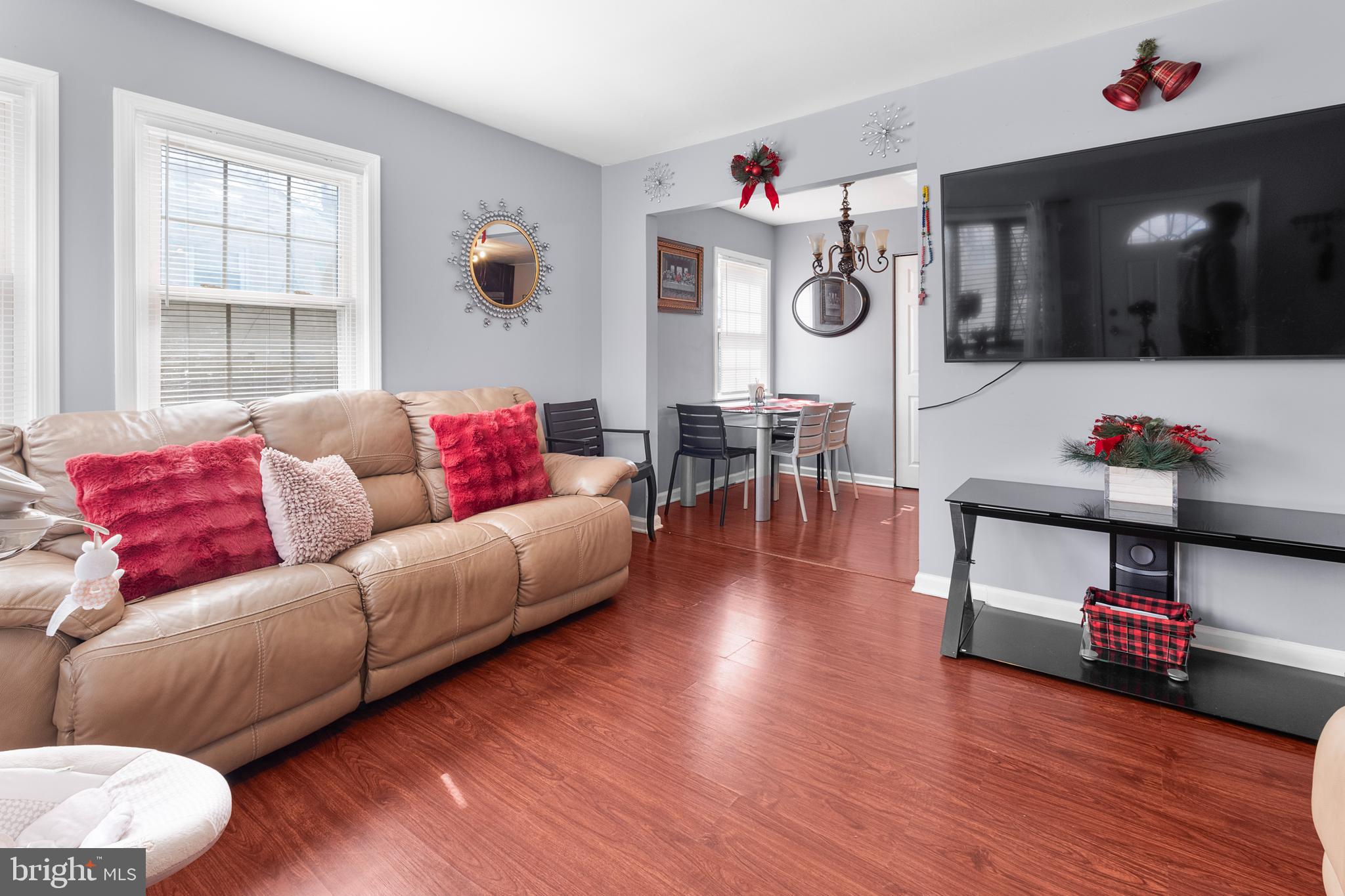 2208 Virginia Avenue Landover, MD 20785 - Photo 5 of 17 a living room with furniture kitchen view and a wooden floor