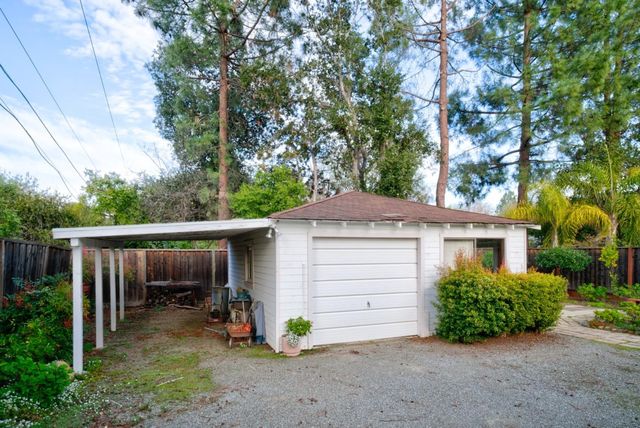a view of backyard with small cabin