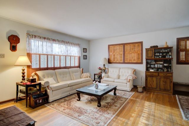 a living room with furniture and a rug