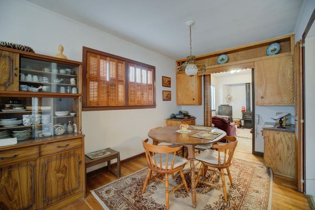 a dining room with furniture and window