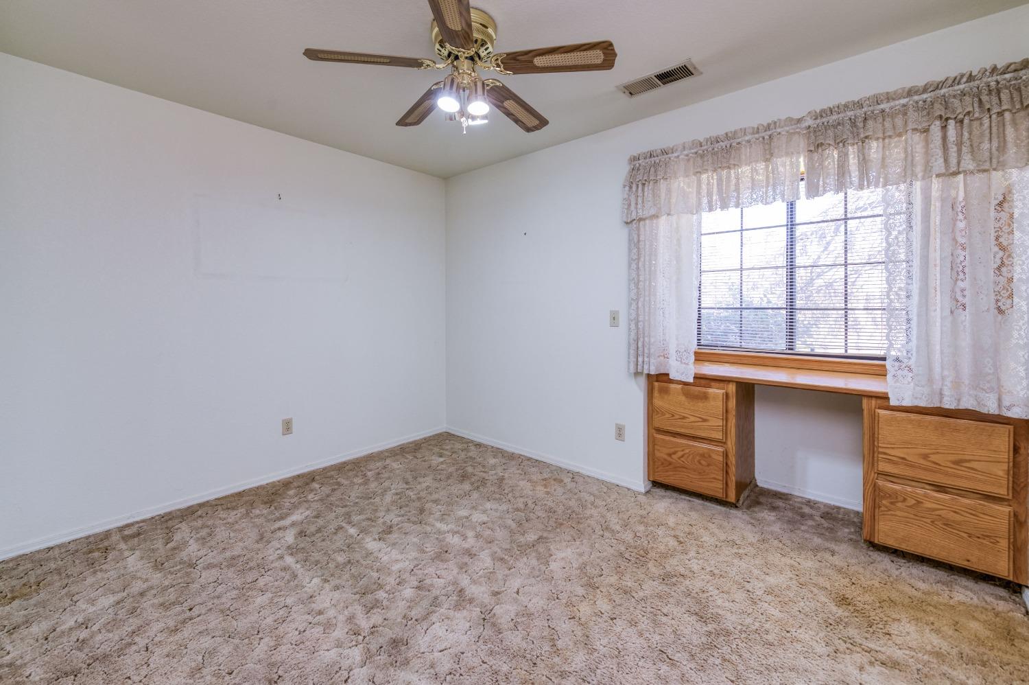 19650 Road 31 Madera, CA 93638 - Photo 15 of 43 an empty room with furniture and windows
