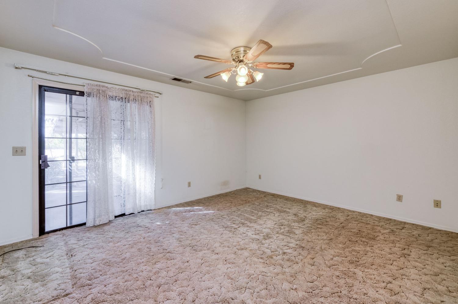 19650 Road 31 Madera, CA 93638 - Photo 18 of 43 an empty room with windows and fan