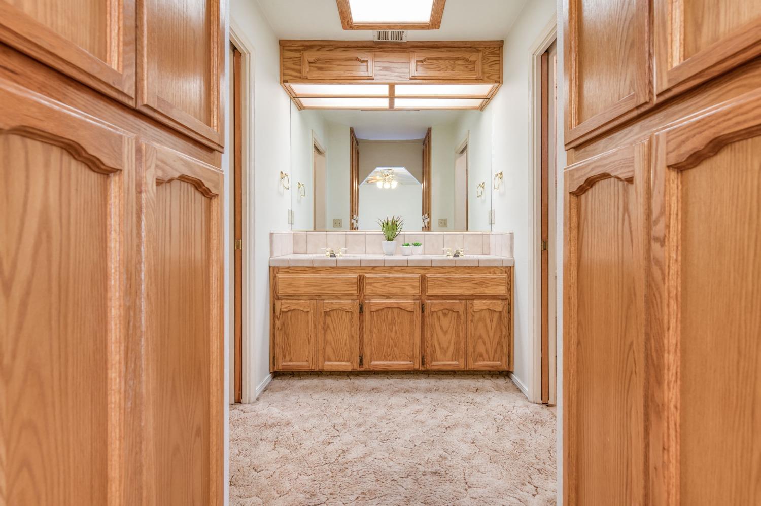 19650 Road 31 Madera, CA 93638 - Photo 20 of 43 a view of a bathroom with a sink and a mirror