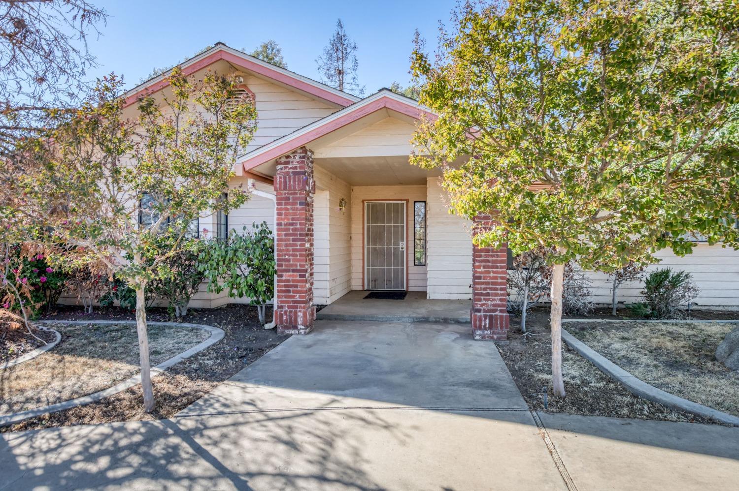 19650 Road 31 Madera, CA 93638 - Photo 2 of 43 a view of a house with a yard