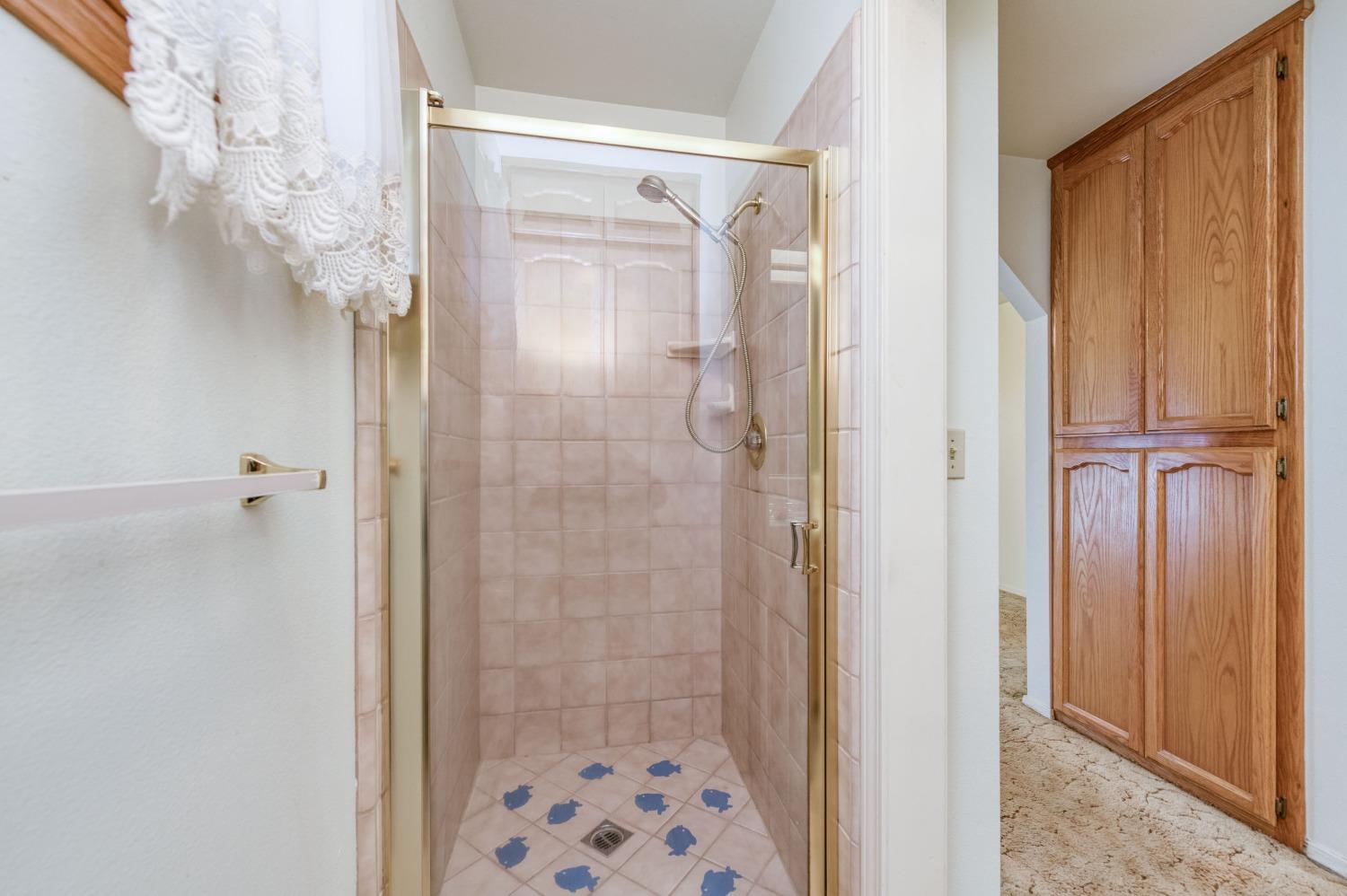 19650 Road 31 Madera, CA 93638 - Photo 22 of 43 a bathroom with a glass shower door