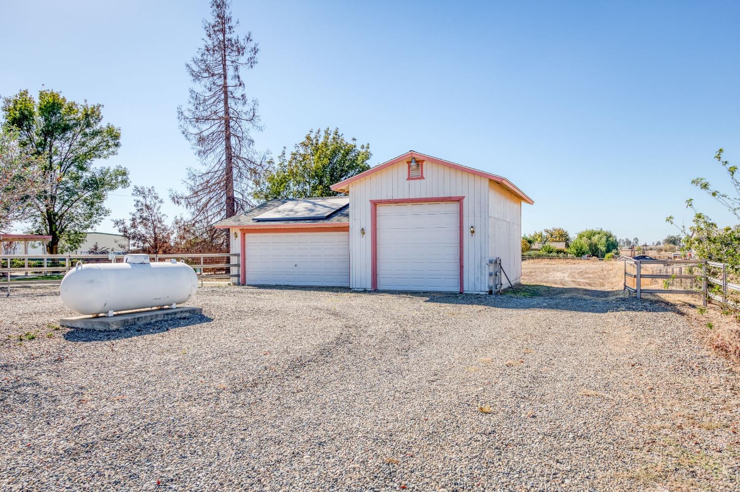 19650 Road 31 Madera, CA 93638 - Photo 28 of 43 a white house that has a tree in front of it