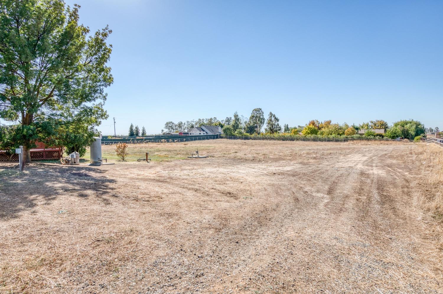 19650 Road 31 Madera, CA 93638 - Photo 29 of 43 a view of a field with trees in the background