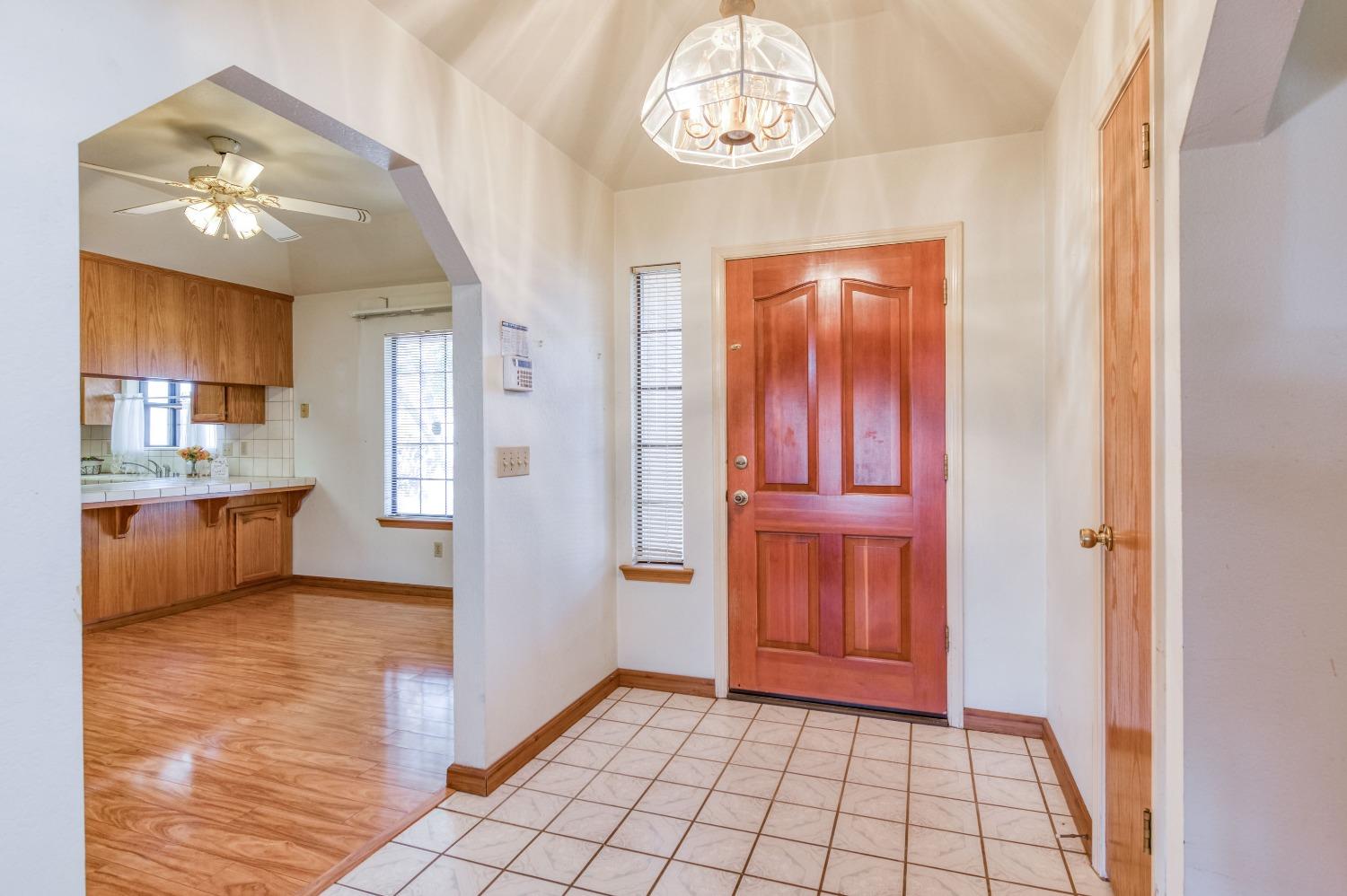 19650 Road 31 Madera, CA 93638 - Photo 5 of 43 a view of an empty room with kitchen and a window