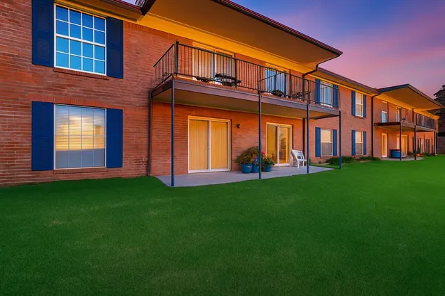 a front view of building with yard