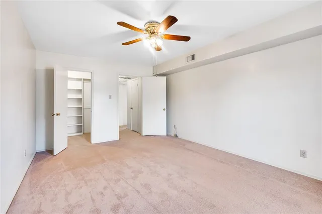 a view of an empty walk in closet