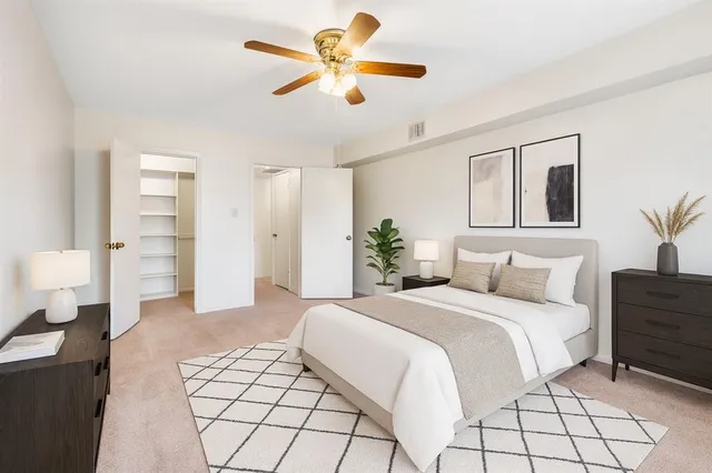 a bathroom with a sink a toilet a mirror and shower