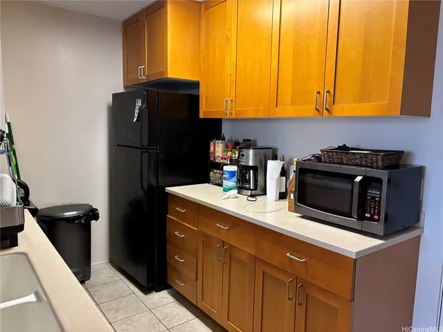 a kitchen with a sink a stove and refrigerator