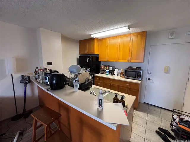 a room with furniture a flat screen tv and a window