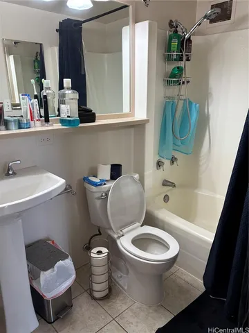 a bathroom with a toilet a sink and bathtub
