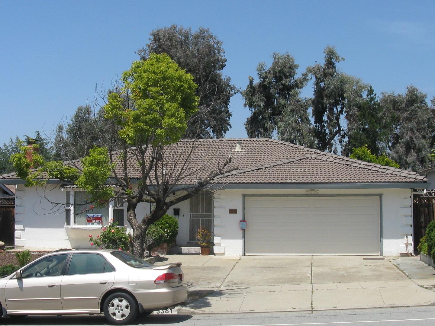 3381 Tully Road San Jose, CA 95148 - Photo 1 of 17 a front view of a house with trees