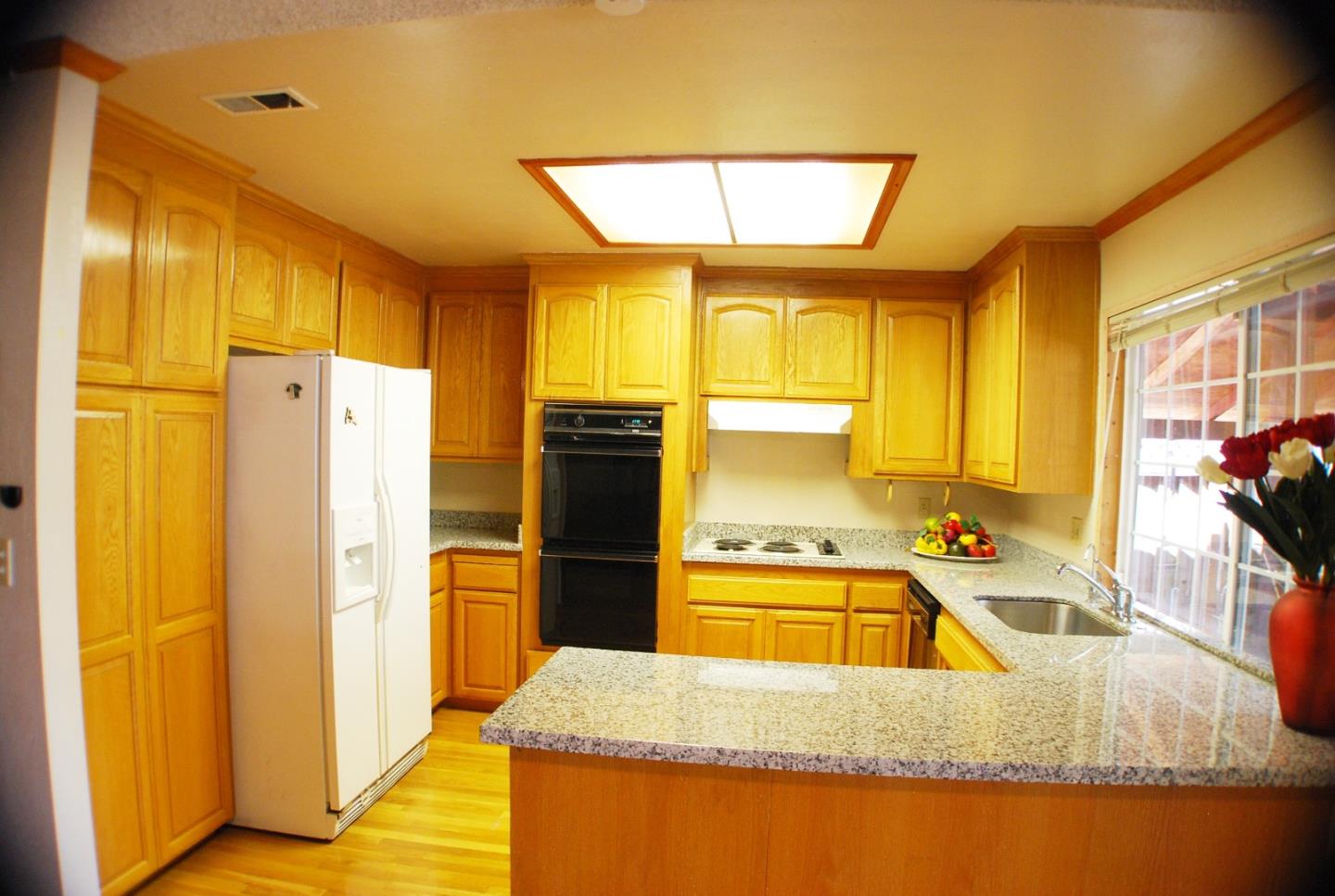 3381 Tully Road San Jose, CA 95148 - Photo 9 of 17 a kitchen with a refrigerator sink and large window