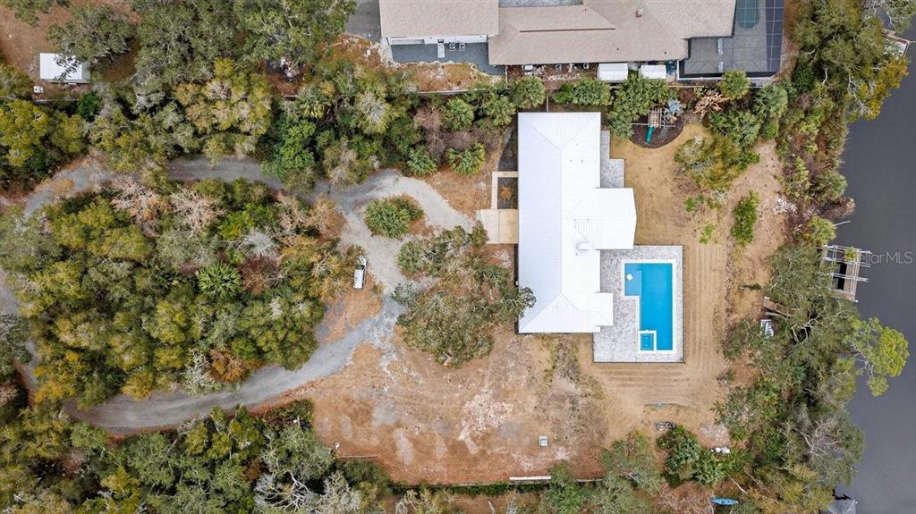 720 Pringle Road Port Orange, FL 32127 - Photo 22 of 68 an aerial view of a house with a yard and large trees