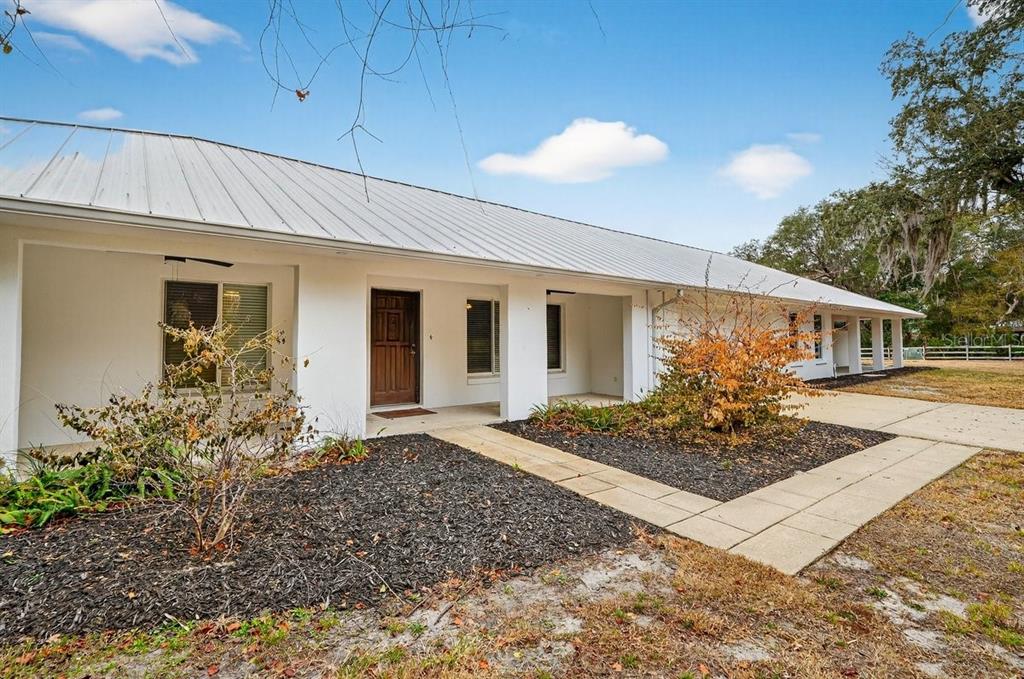 720 Pringle Road Port Orange, FL 32127 - Photo 25 of 68 a front view of a house with garden