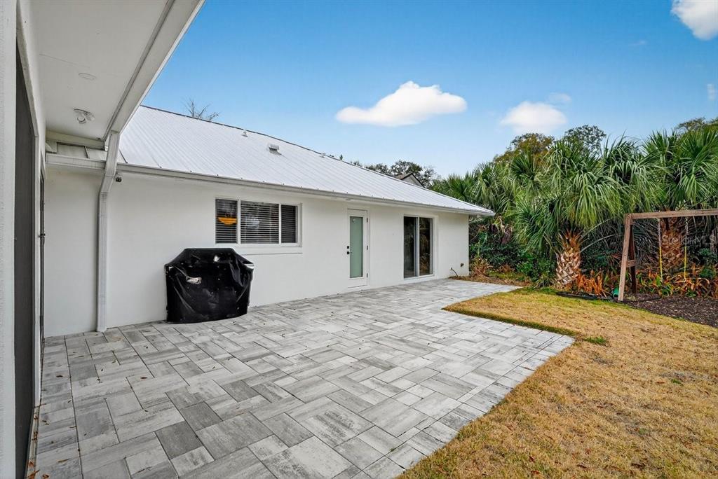 720 Pringle Road Port Orange, FL 32127 - Photo 28 of 68 a view of a house with backyard and sitting area