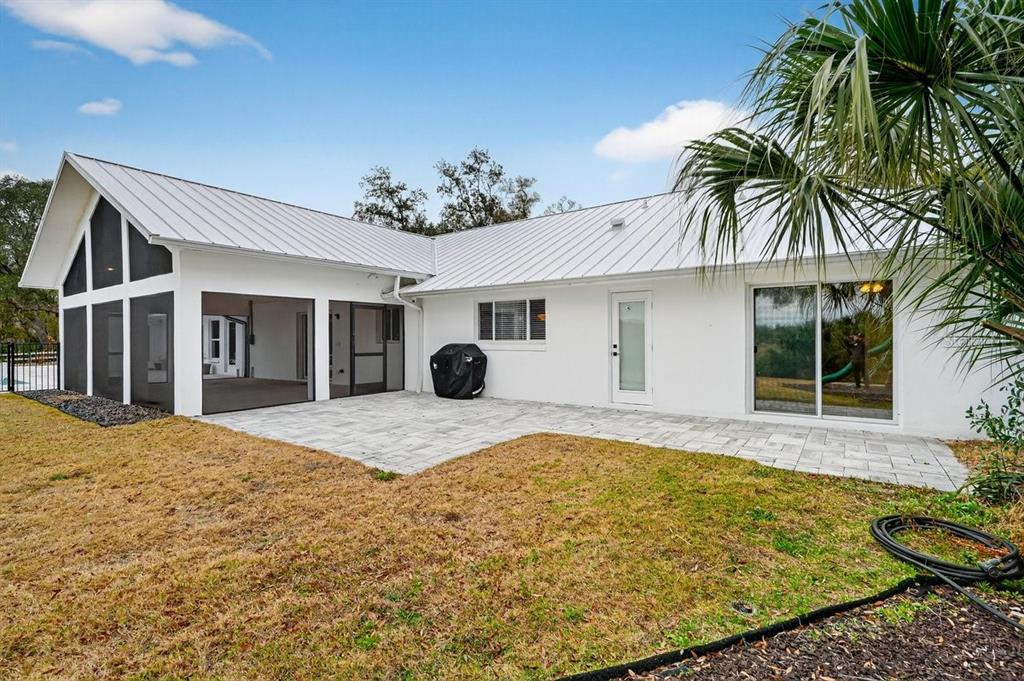 720 Pringle Road Port Orange, FL 32127 - Photo 29 of 68 a view of a house with a yard and potted plants