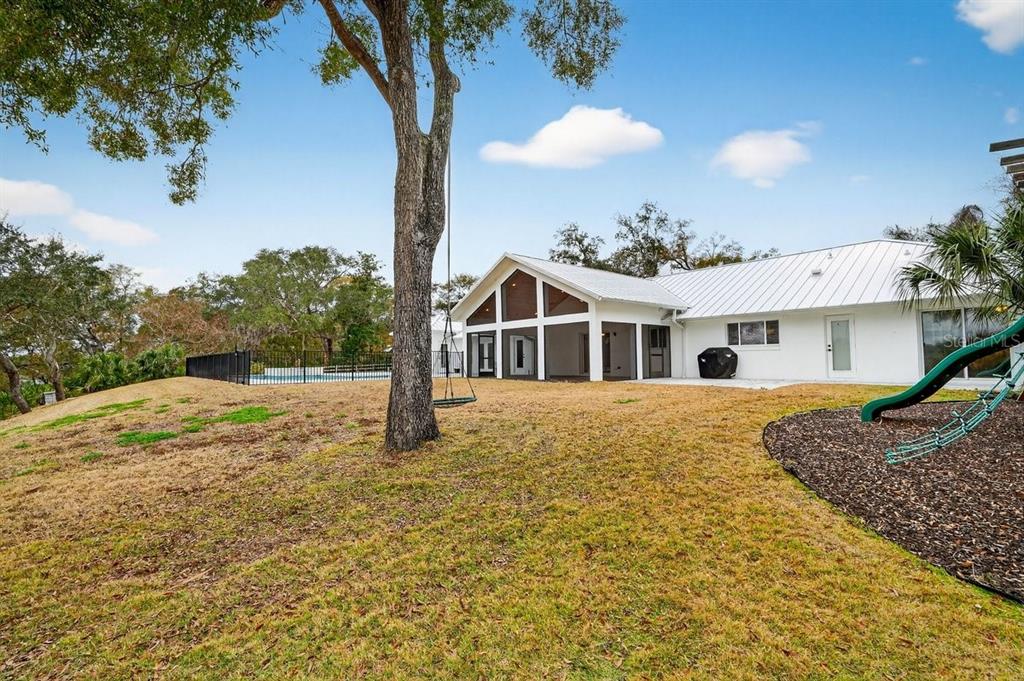 720 Pringle Road Port Orange, FL 32127 - Photo 30 of 68 a front view of a house with a yard