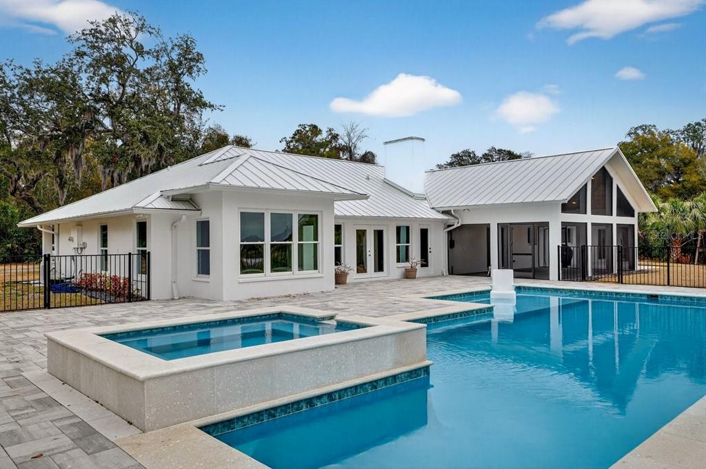 720 Pringle Road Port Orange, FL 32127 - Photo 3 of 68 a front view of a house with a yard table and chairs