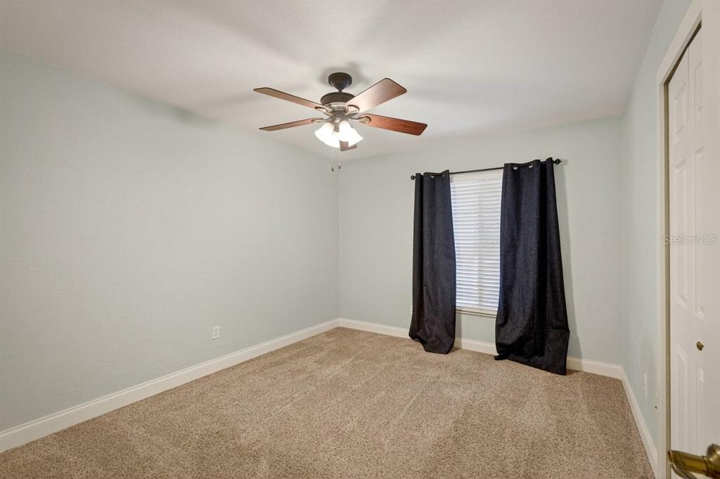 720 Pringle Road Port Orange, FL 32127 - Photo 53 of 68 a view of a room with a ceiling fan and a window
