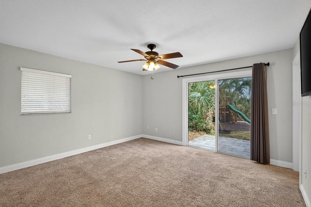 720 Pringle Road Port Orange, FL 32127 - Photo 57 of 68 an empty room with fan and windows