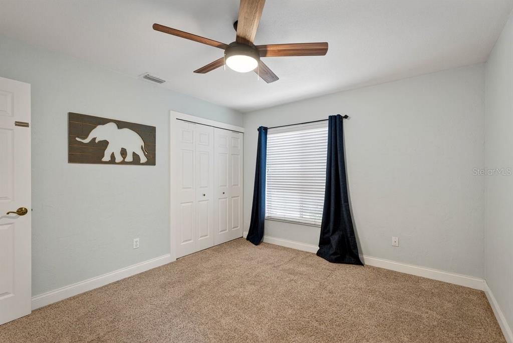 720 Pringle Road Port Orange, FL 32127 - Photo 62 of 68 an empty room with closet and fan