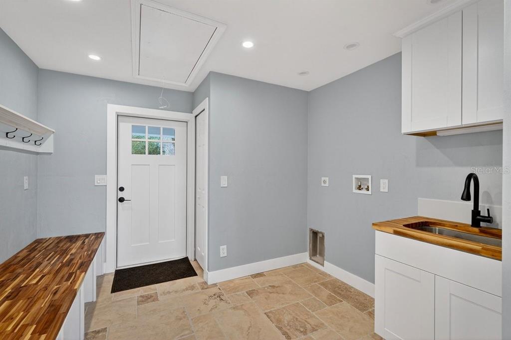 720 Pringle Road Port Orange, FL 32127 - Photo 64 of 68 a bedroom with a bed and cabinets