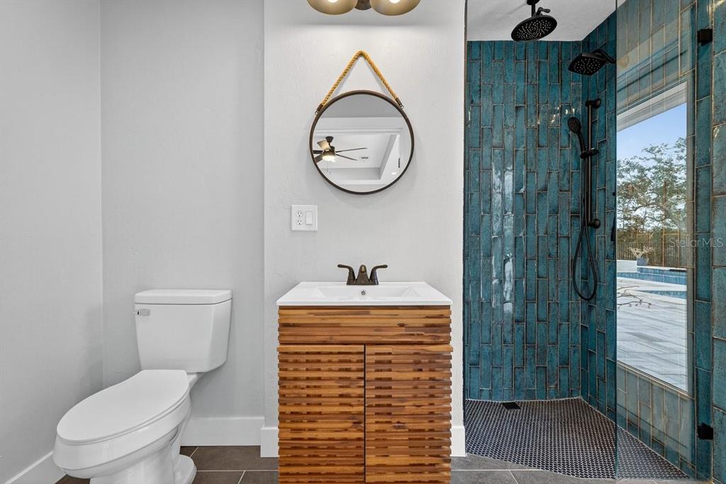 720 Pringle Road Port Orange, FL 32127 - Photo 8 of 68 a bathroom with a sink a toilet and a shower