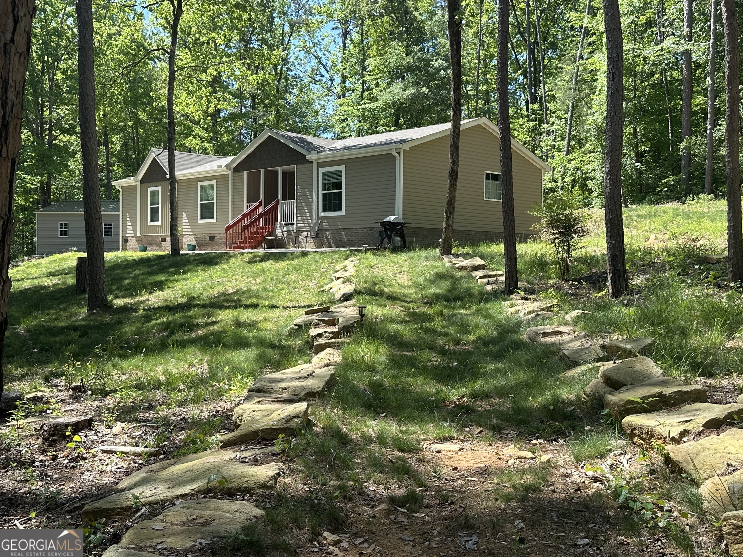 347 River Trail Martin, GA 30557 - Photo 1 of 1 a view of a house with a yard and plants