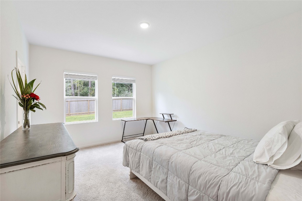 3626 Addington Ct. Huffman, TX 77336 - Photo 13 of 26 a bedroom with a bed and a window