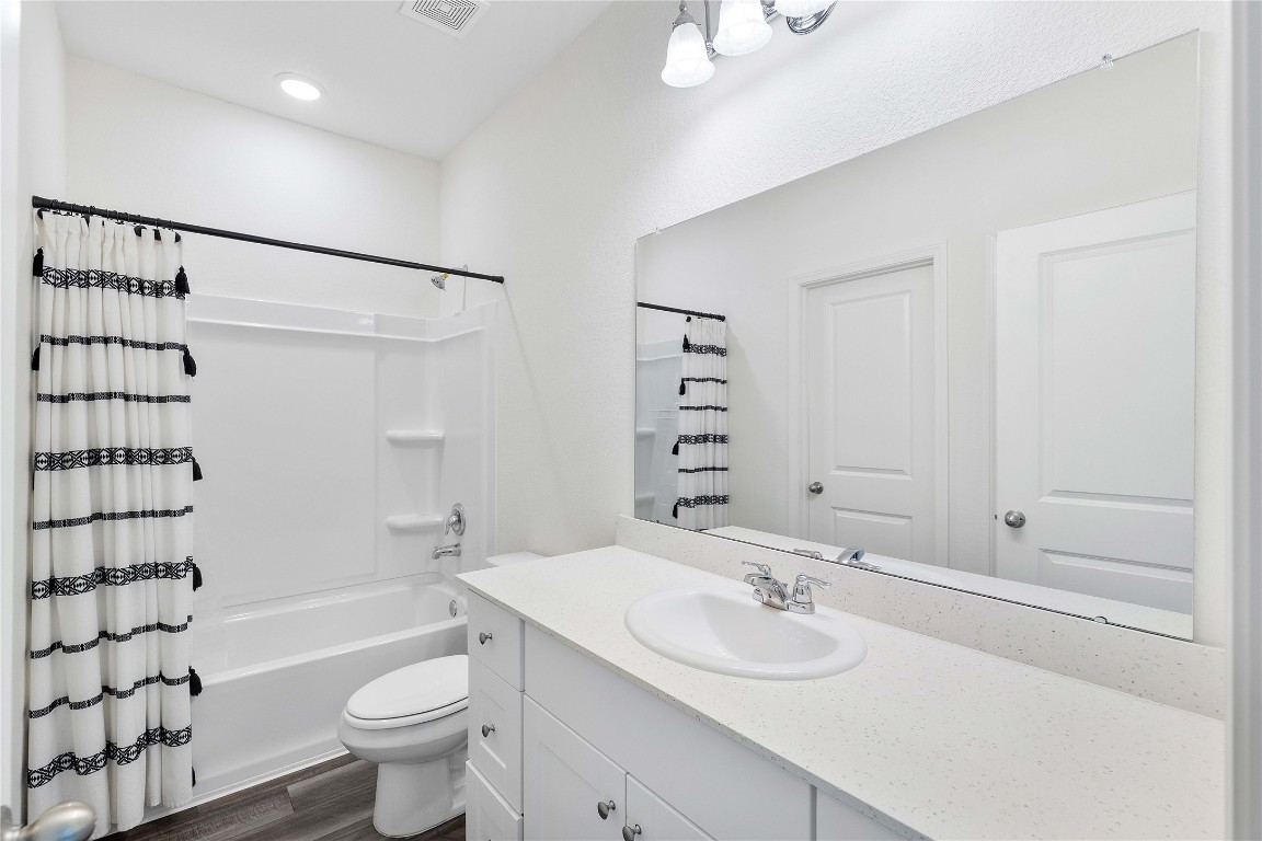 3626 Addington Ct. Huffman, TX 77336 - Photo 16 of 26 a bathroom with a sink a toilet and shower