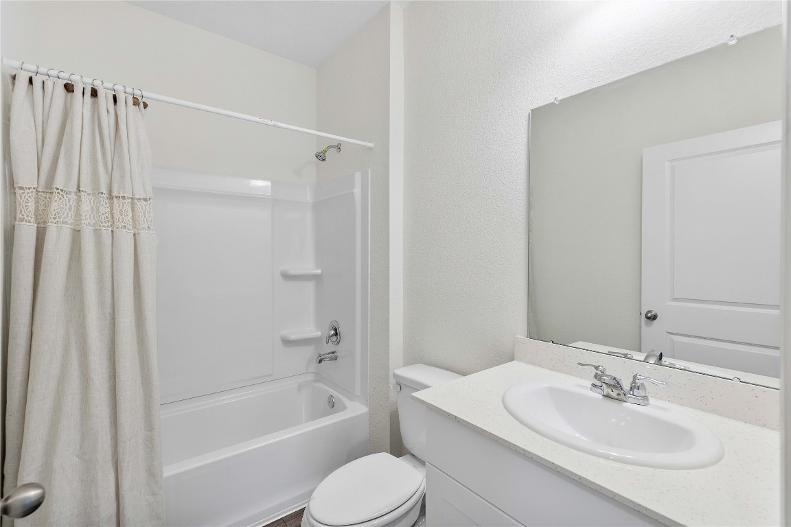 3626 Addington Ct. Huffman, TX 77336 - Photo 19 of 26 a bathroom with a sink toilet and shower