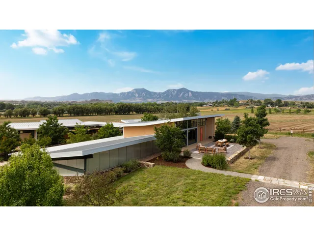 a balcony with furniture and city view