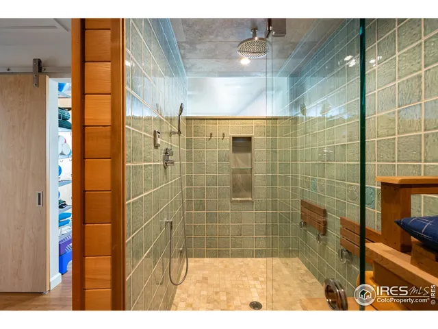 a room with pool table and windows