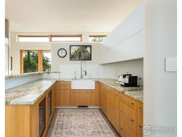 a kitchen with stainless steel appliances granite countertop a sink and cabinets