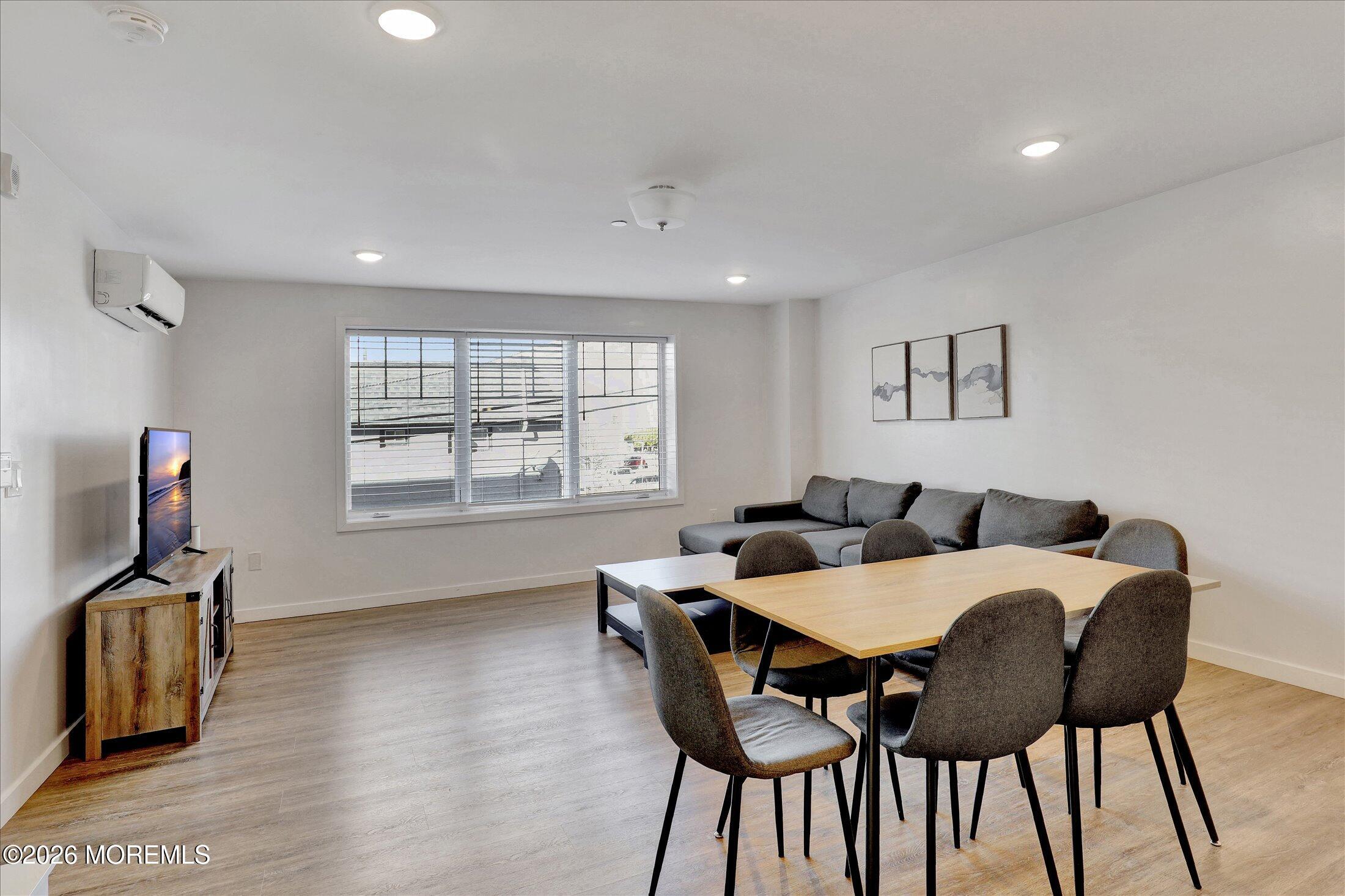 55 Brighton Avenue, Unit 4 Long Branch, NJ 07740 - Photo 14 of 36 a view of a dining room with furniture and a window