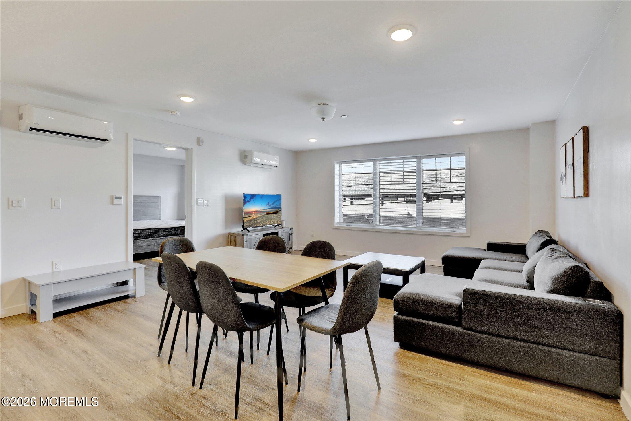 55 Brighton Avenue, Unit 4 Long Branch, NJ 07740 - Photo 15 of 36 a living room with furniture and a window