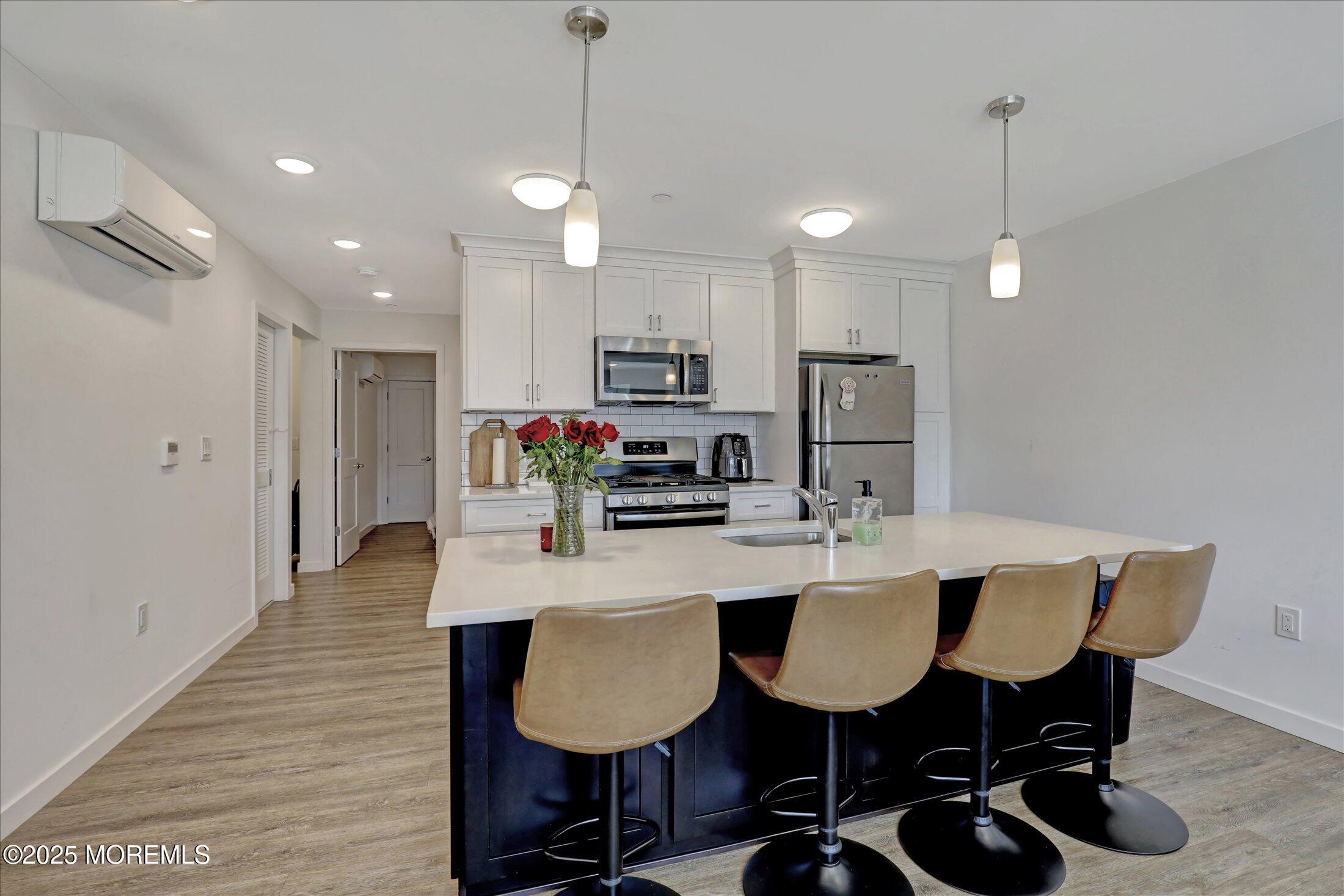 55 Brighton Avenue, Unit 4 Long Branch, NJ 07740 - Photo 2 of 33 a view of a dining room with furniture