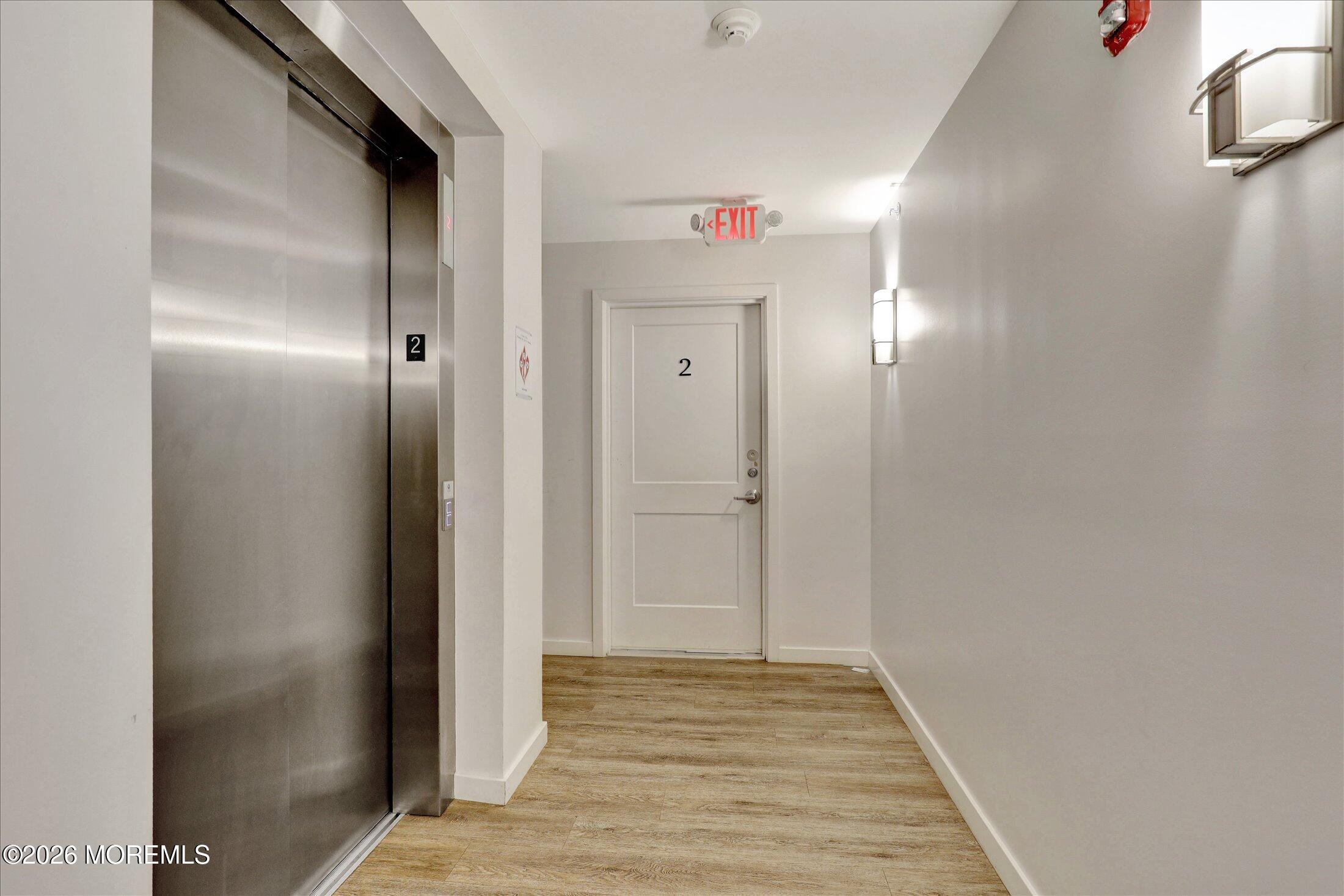 55 Brighton Avenue, Unit 4 Long Branch, NJ 07740 - Photo 7 of 36 a view of a hallway with wooden floor