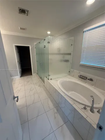 a bathroom with a bathtub and a sink